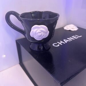 Elegant Black Cup with White Rose Detail